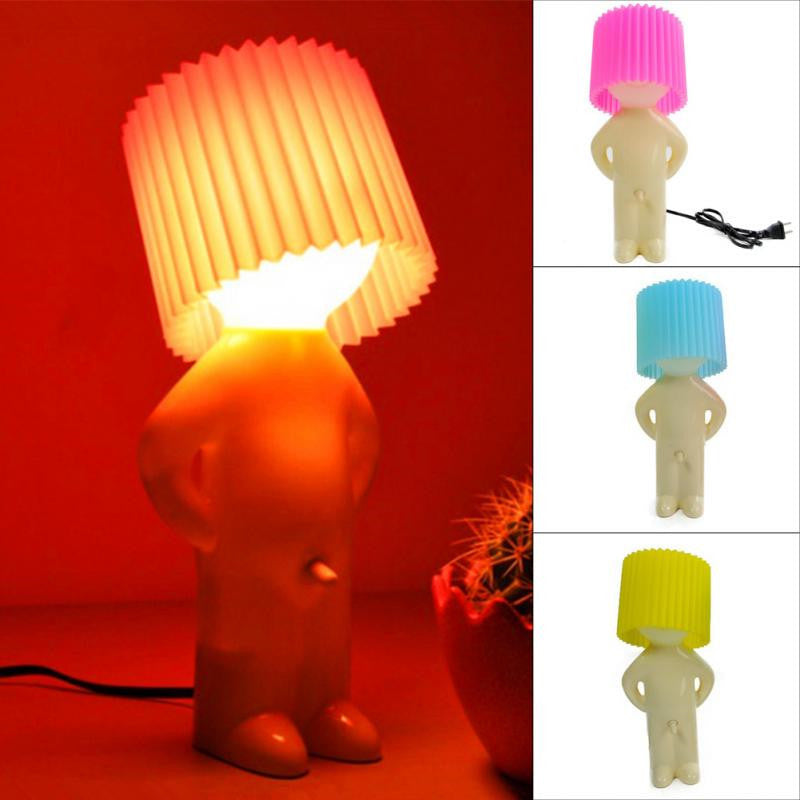 Shy little boy reading lamp